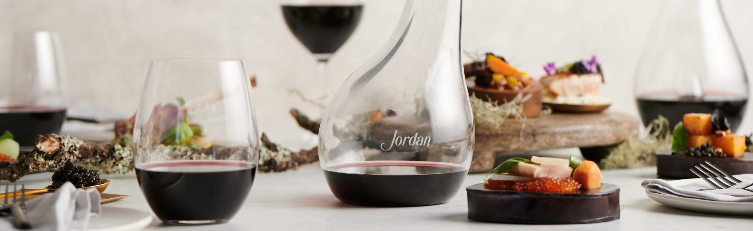 Wine glasses and a bottle on a table - luxury wine accessories at