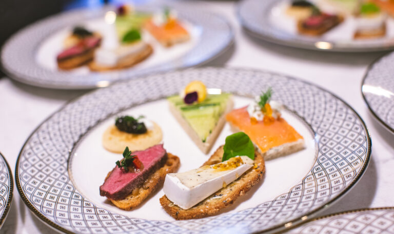 small tea sandwiches on decorative plate