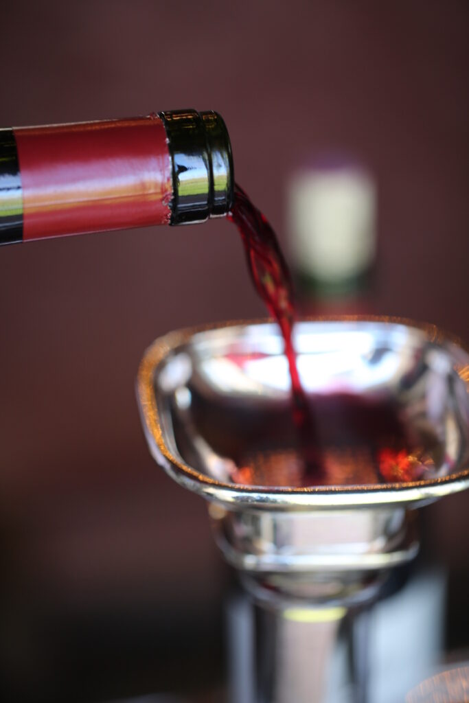 close up image of cabernet sauvignon being poured into a decanter